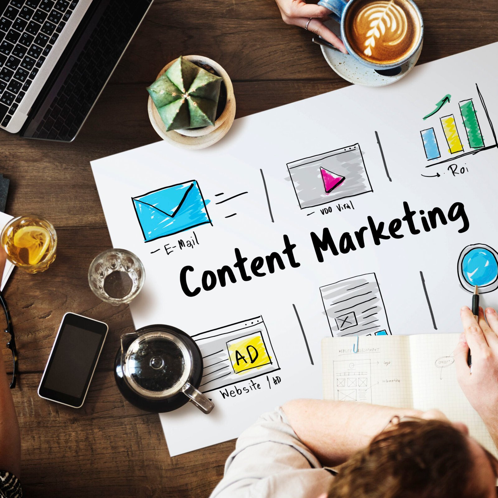 Online strategy and media marketing icons arranged around a laptop